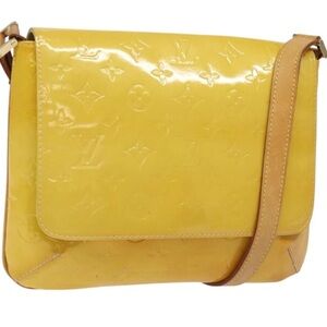 Authentic  Louis Vuitton Vernis Thompson Shoulder Bag with Classic Design.